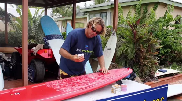 Waxing a surfboard
